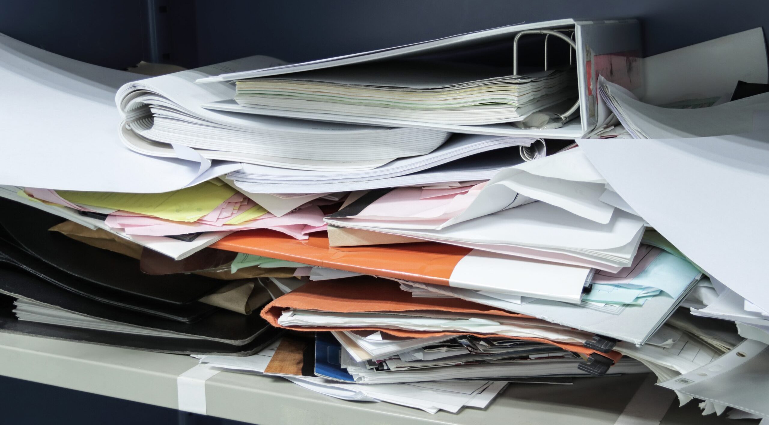 Messy file document and Office Supplies in filing cabinets at wo Messy file document and Office Supplies in filing cabinets at work office